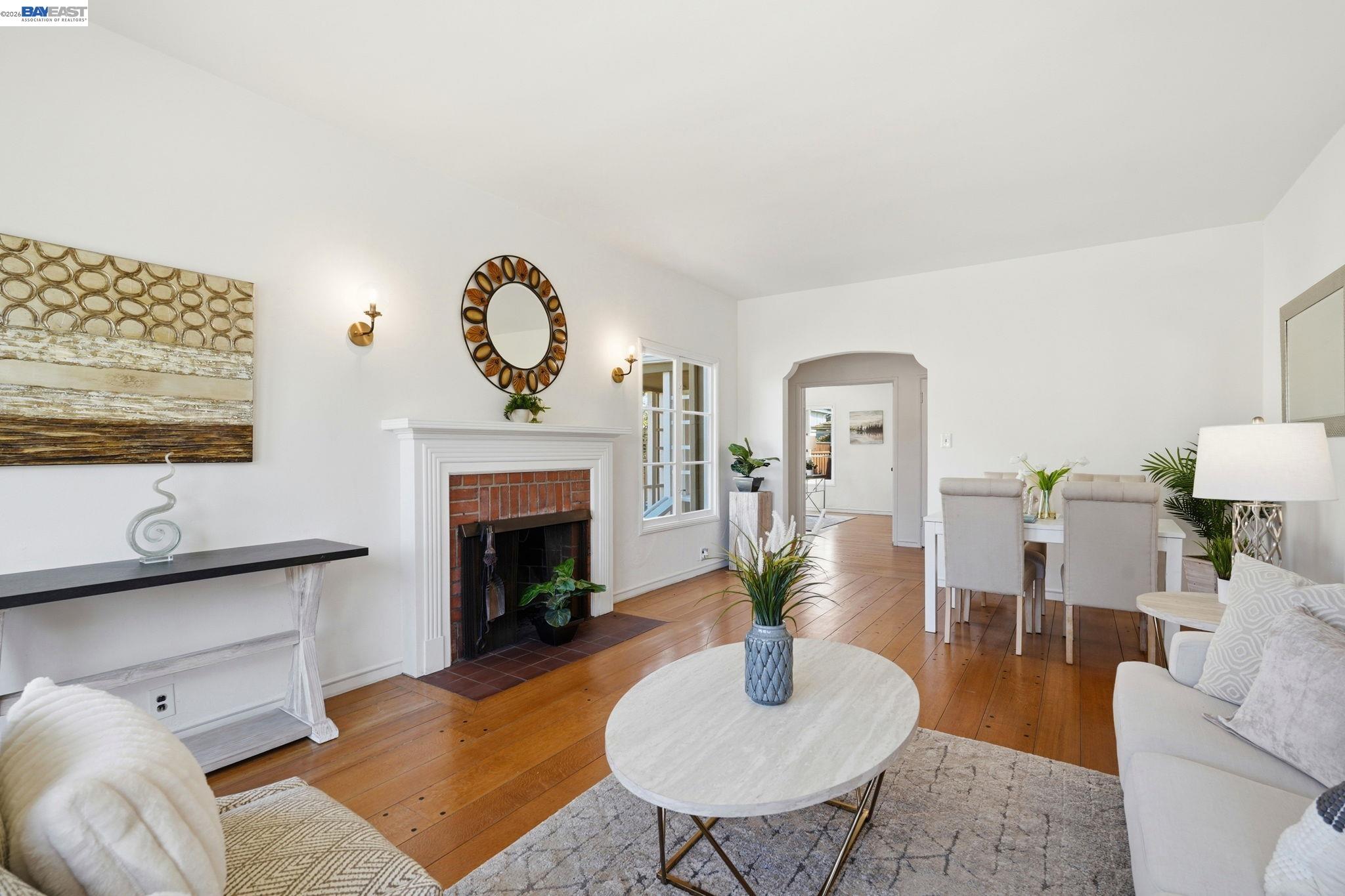 1368 Rose Street Berkeley, CA 94702 - Photo 5 of 21 a living room with furniture a table and a fireplace