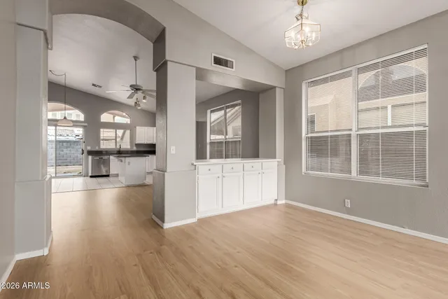 a view of livingroom with furniture wooden floor and windows
