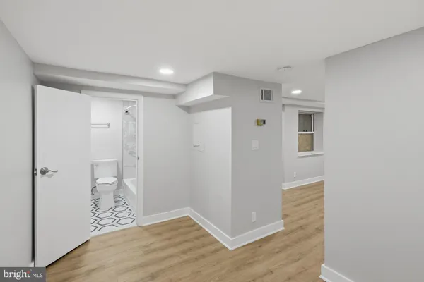 a view of entryway with wooden floor