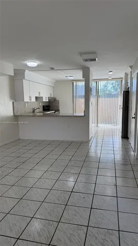 a view of a kitchen with electric appliances