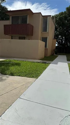 a view of backyard with potted plants