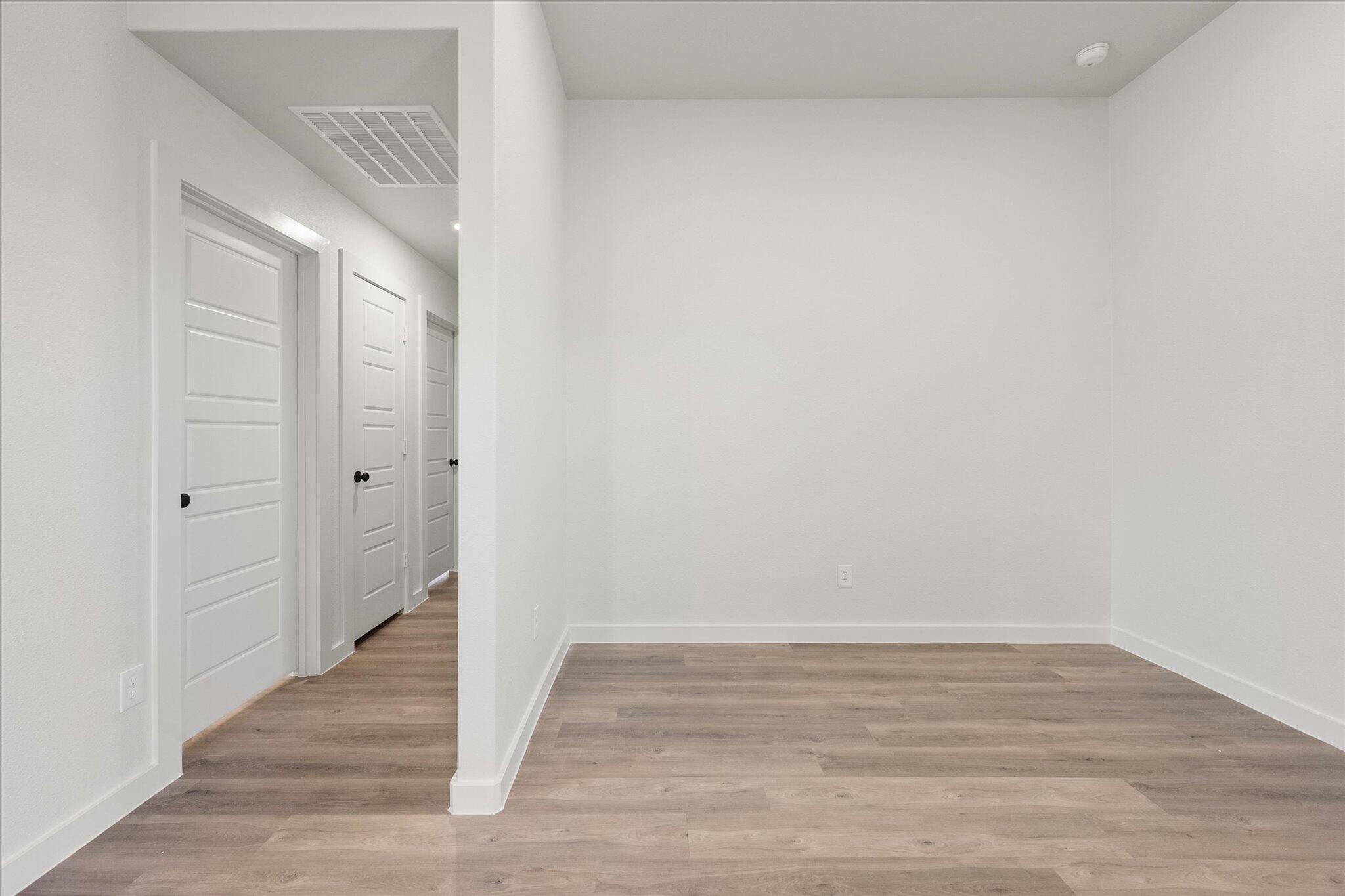3108 138th Place Lubbock, TX 79423 - Photo 12 of 21 a view of a room with wooden floor