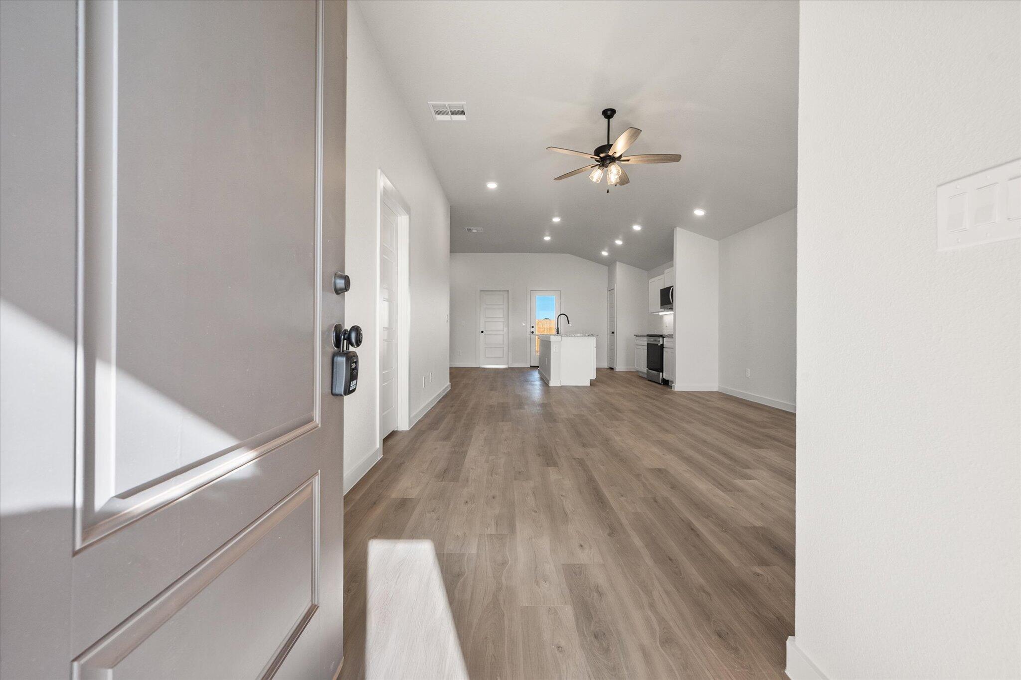 3108 138th Place Lubbock, TX 79423 - Photo 2 of 21 a view of a hallway with wooden floor