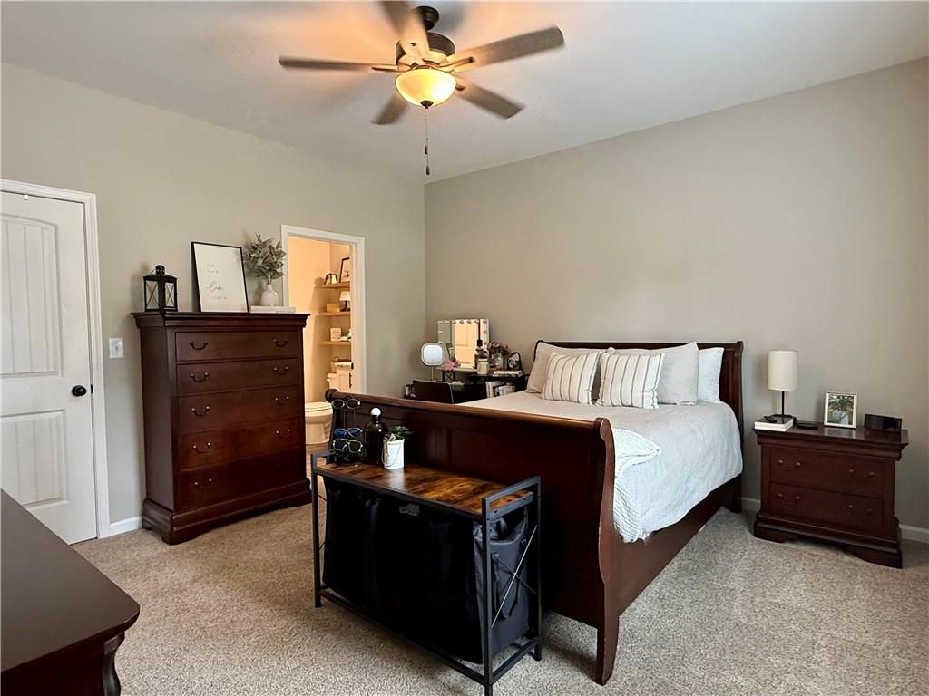 1776 Pleasant Grove Road Temple, GA 30179 - Photo 18 of 45 a bedroom with a bed and wooden floor
