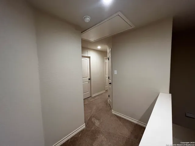 a bathroom with a shower and a mirror