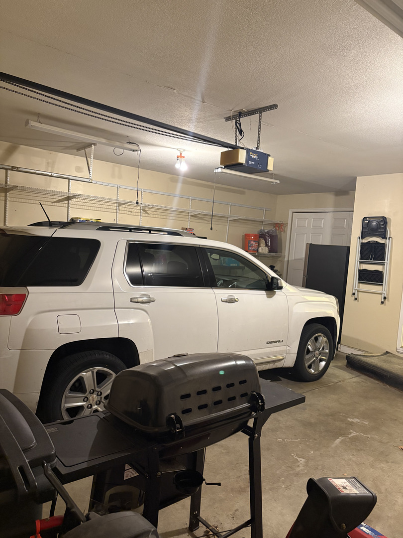 1003 Cyndy Lane Champaign, IL 61822 - Photo 19 of 25 a view of a car parked in garage