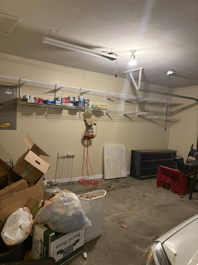 1003 Cyndy Lane Champaign, IL 61822 - Photo 20 of 25 a room with storage and a table