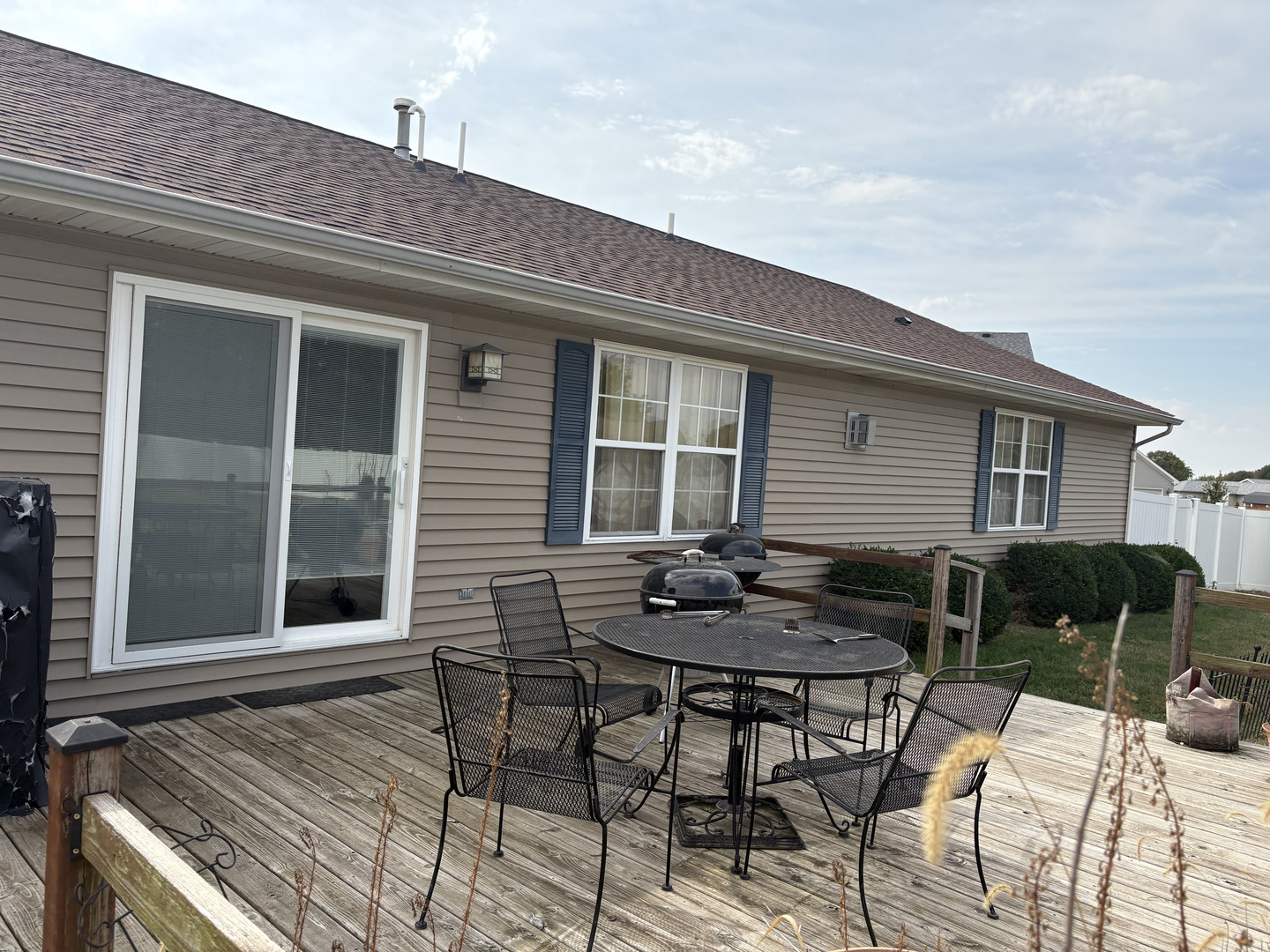 1003 Cyndy Lane Champaign, IL 61822 - Photo 24 of 25 a backyard of a house with table and chairs