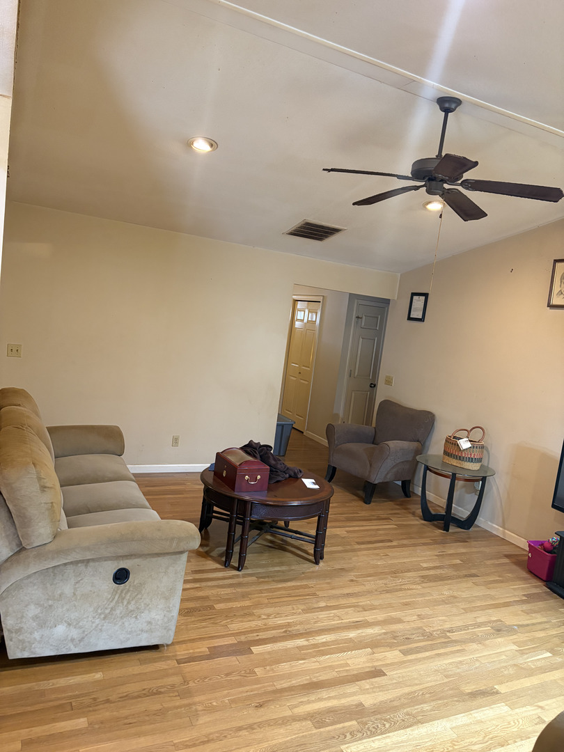 1003 Cyndy Lane Champaign, IL 61822 - Photo 10 of 25 a living room with furniture and a wooden floor
