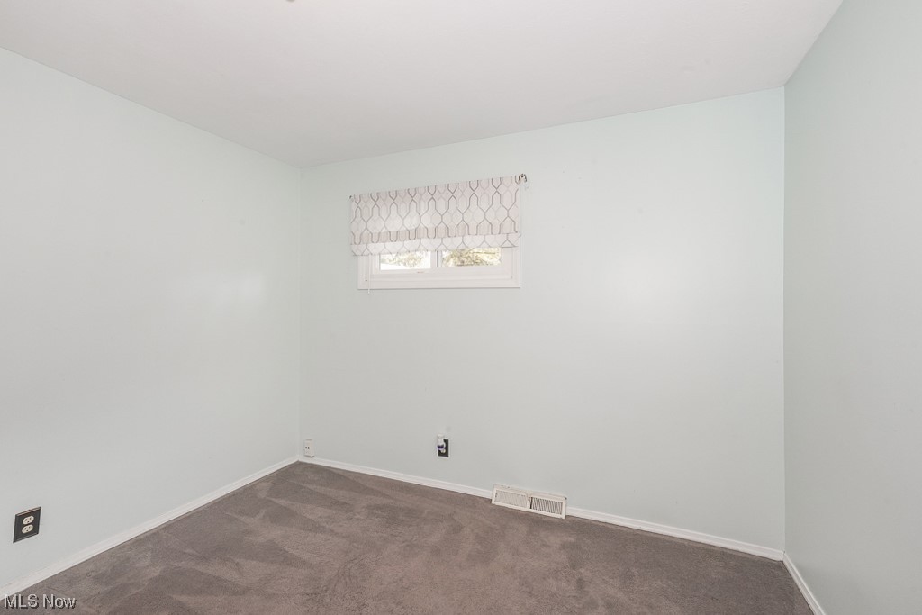 1127 Garden Road Willoughby, OH 44094 - Photo 17 of 33 Unfurnished room featuring dark colored carpet
