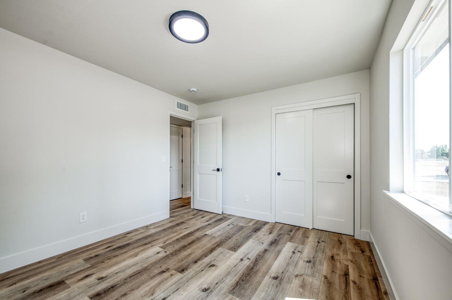 16715 Monreal Road Madera, CA 93636 - Photo 19 of 39 a view of an empty room and window