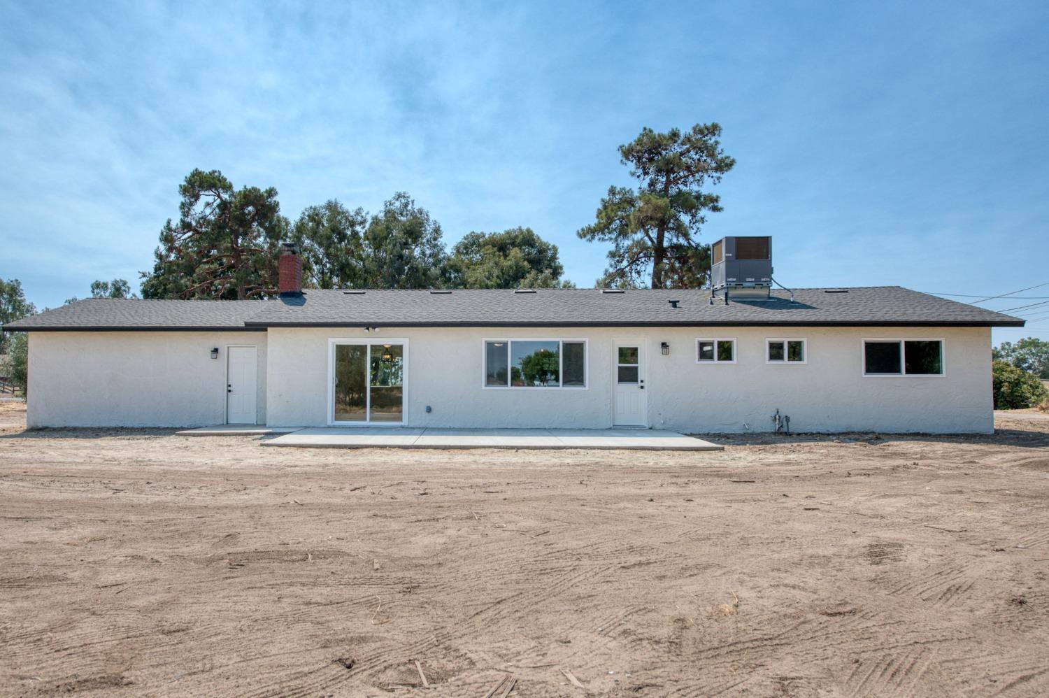 16715 Monreal Road Madera, CA 93636 - Photo 21 of 39 a house that has a tree in front of it