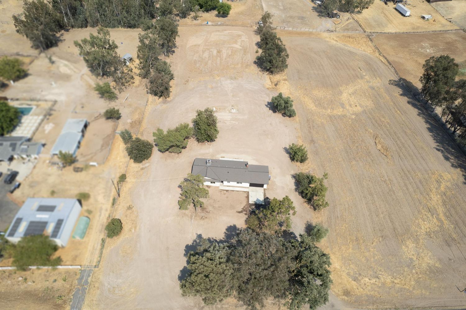 16715 Monreal Road Madera, CA 93636 - Photo 27 of 39 an aerial view of residential houses with outdoor space