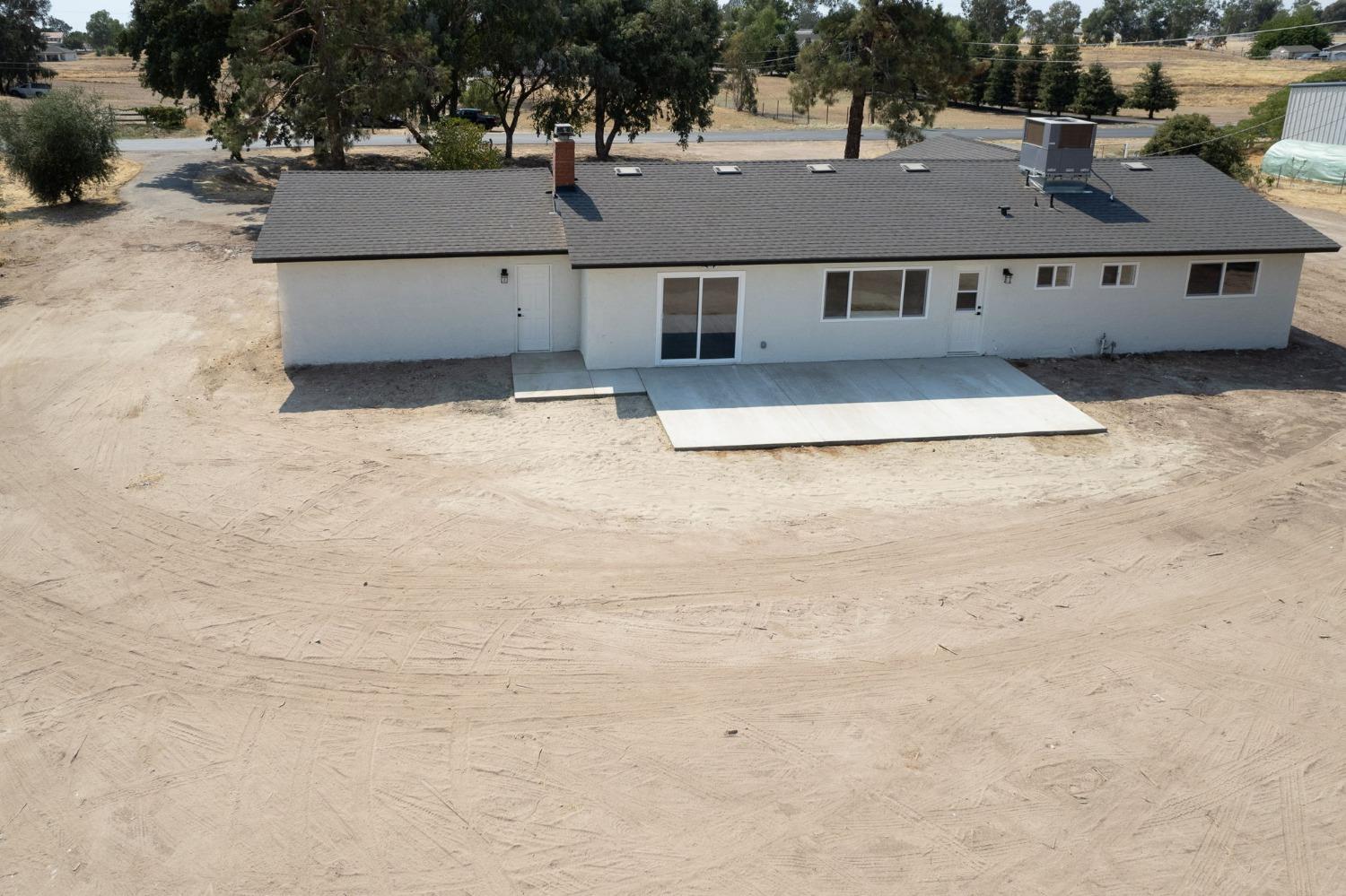 16715 Monreal Road Madera, CA 93636 - Photo 31 of 39 an aerial view of a house with a yard