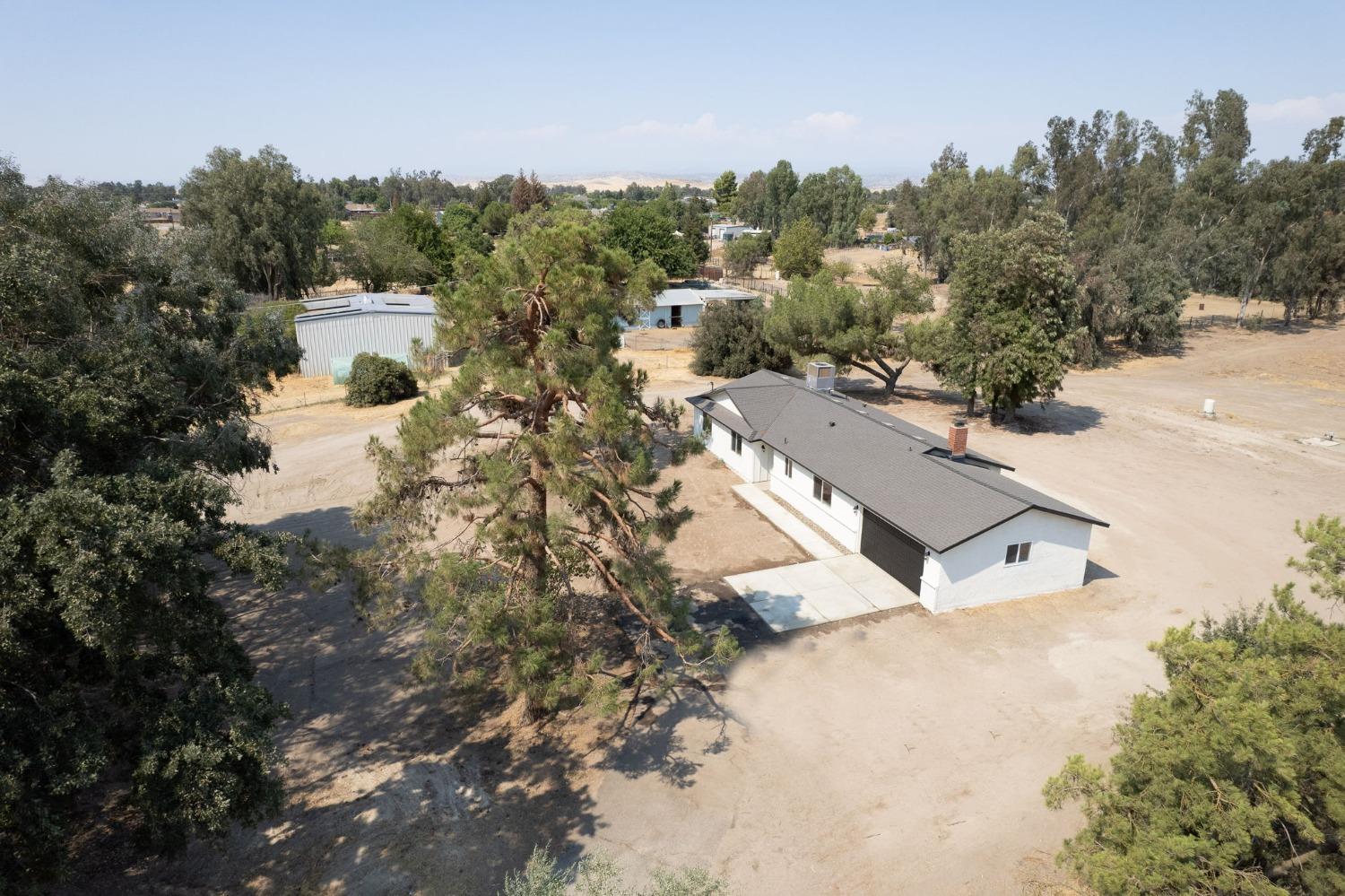 16715 Monreal Road Madera, CA 93636 - Photo 33 of 39 a view of a house with a outdoor space