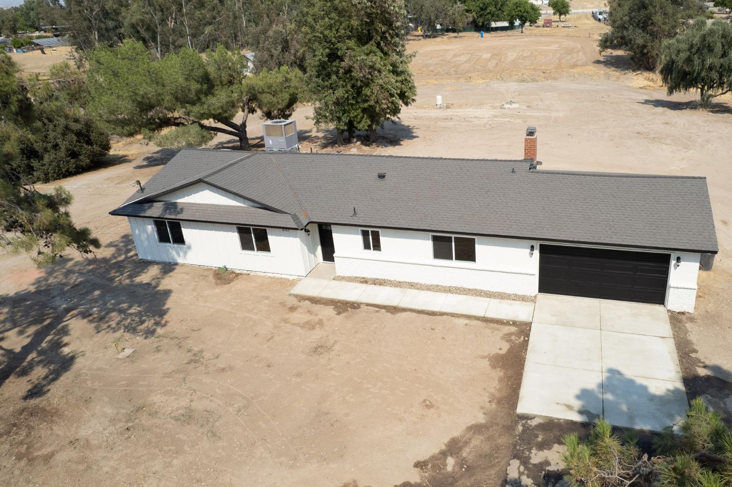 16715 Monreal Road Madera, CA 93636 - Photo 38 of 39 a house with trees in the background