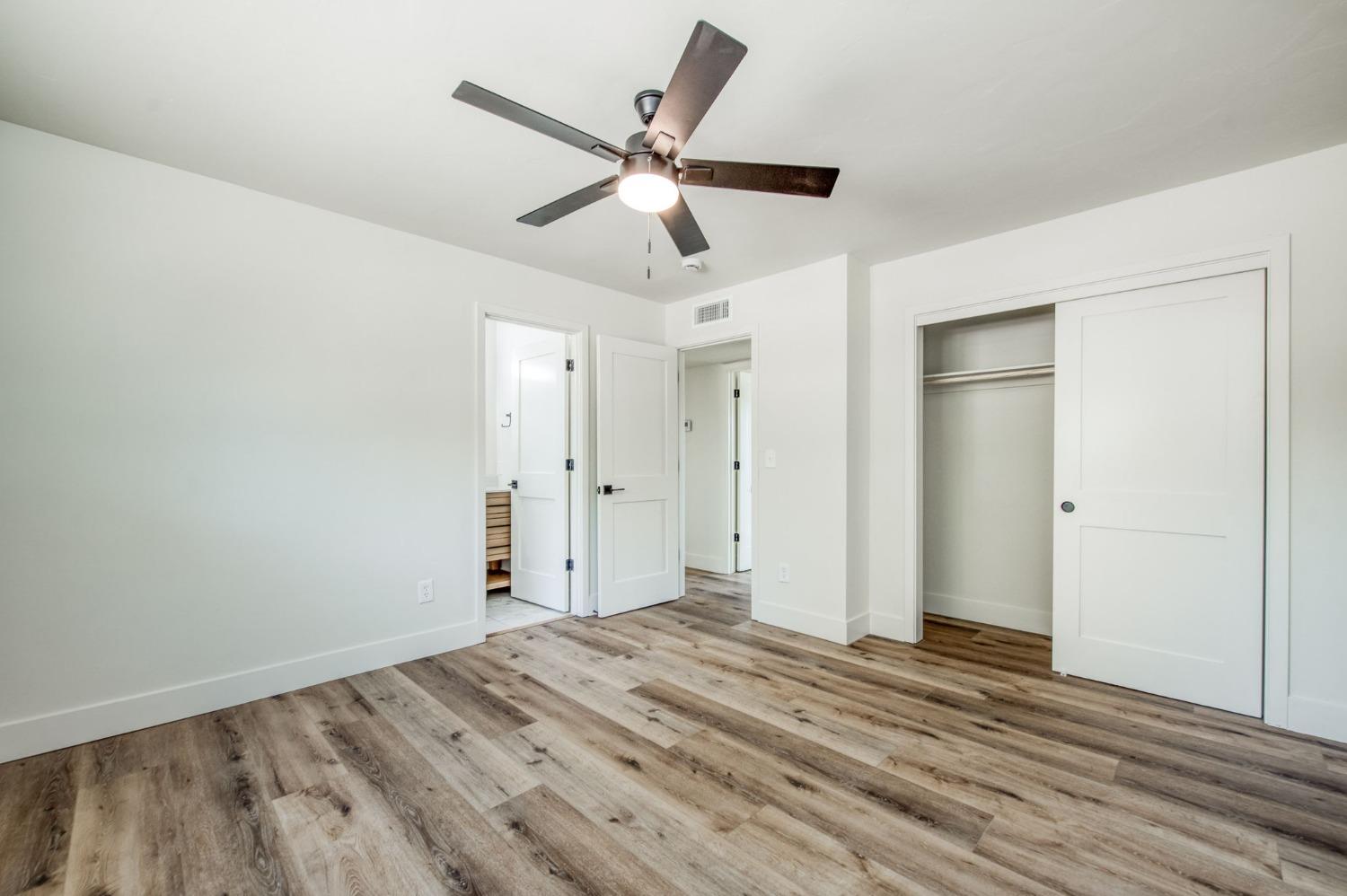 16715 Monreal Road Madera, CA 93636 - Photo 6 of 39 a view of empty room with wooden floor