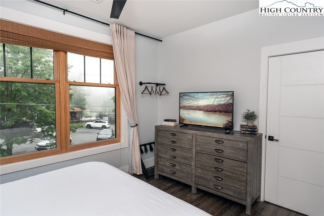 1150 Main Street, Unit DOGWOOD Blowing Rock, NC 28605 - Photo 14 of 26 a room with furniture and flat screen tv