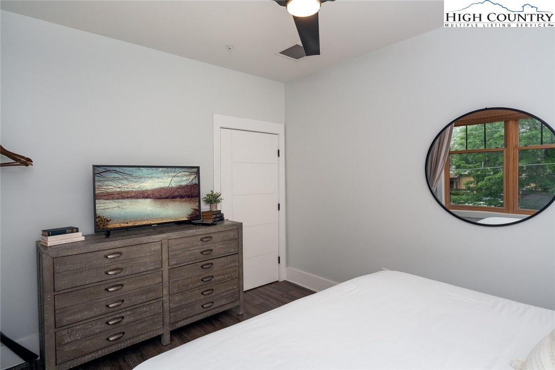 1150 Main Street, Unit DOGWOOD Blowing Rock, NC 28605 - Photo 15 of 26 a living room with furniture and a flat screen tv