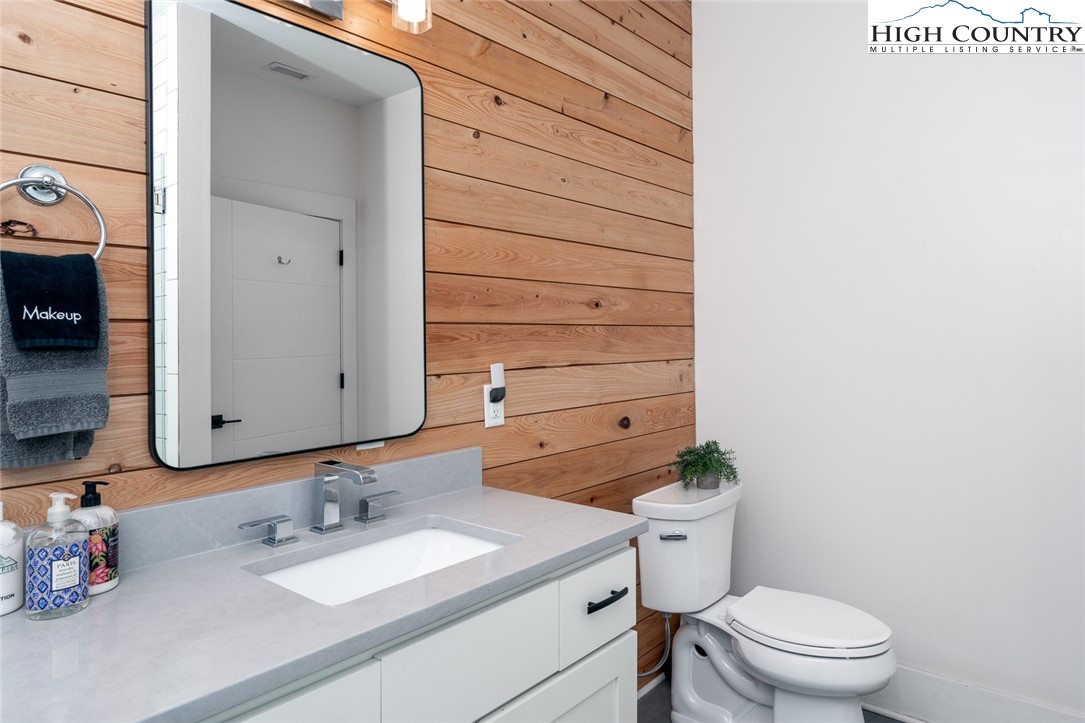 1150 Main Street, Unit DOGWOOD Blowing Rock, NC 28605 - Photo 17 of 26 a bathroom with a sink a toilet and shower