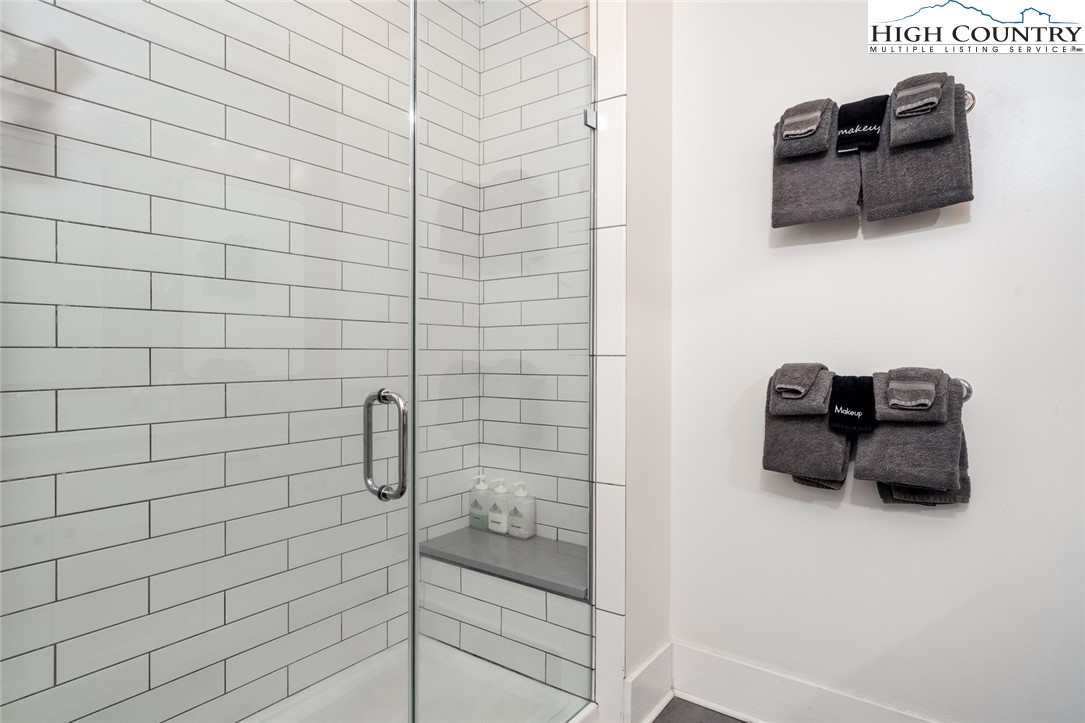 1150 Main Street, Unit DOGWOOD Blowing Rock, NC 28605 - Photo 18 of 26 a bathroom with a shower