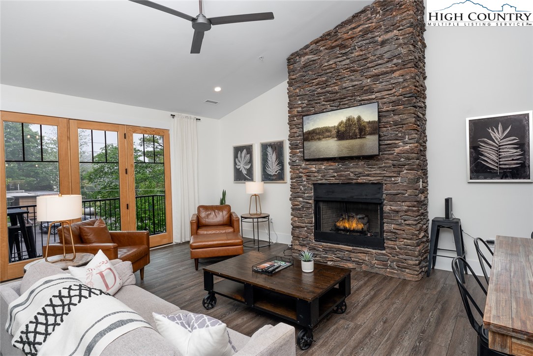 1150 Main Street, Unit DOGWOOD Blowing Rock, NC 28605 - Photo 2 of 26 a living room with furniture and a fireplace