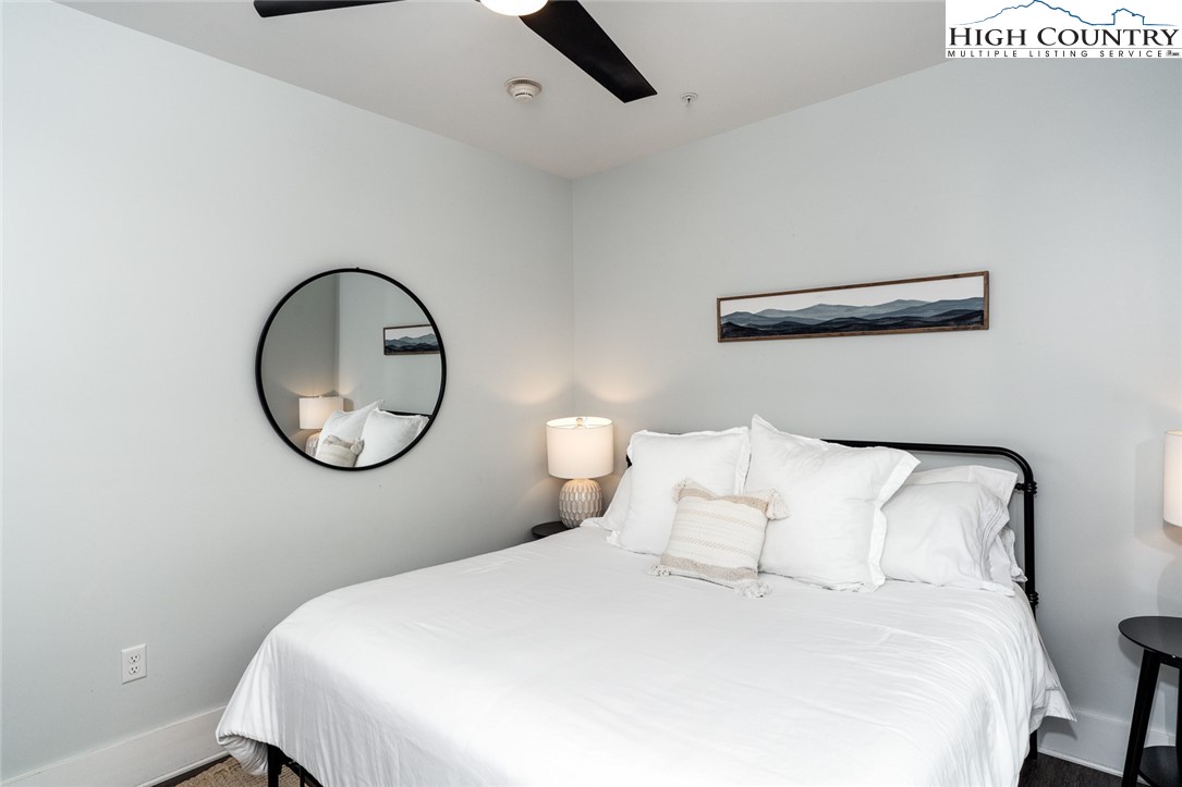 1150 Main Street, Unit DOGWOOD Blowing Rock, NC 28605 - Photo 21 of 26 a bedroom with a bed and a window