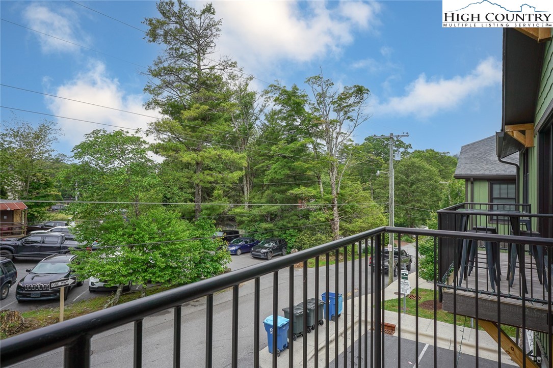 1150 Main Street, Unit DOGWOOD Blowing Rock, NC 28605 - Photo 26 of 26 a view of a balcony with an outdoor seating