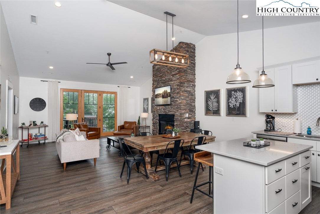 1150 Main Street, Unit DOGWOOD Blowing Rock, NC 28605 - Photo 3 of 26 a living room with fireplace furniture and a large window