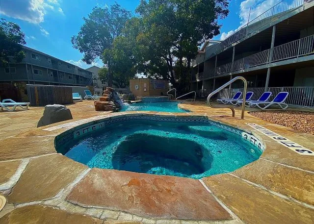a view of a swimming pool with an outdoor space and seating area