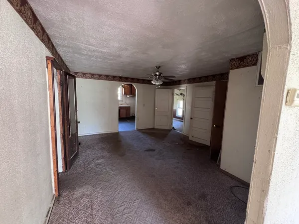 a view of a hallway with furniture