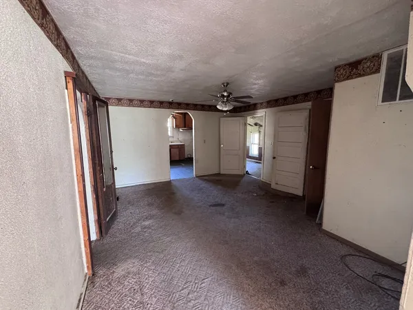 a view of a hallway with stairs