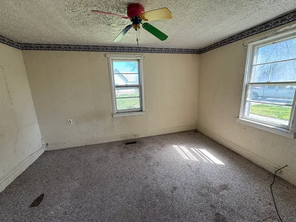 a view of an empty room and window
