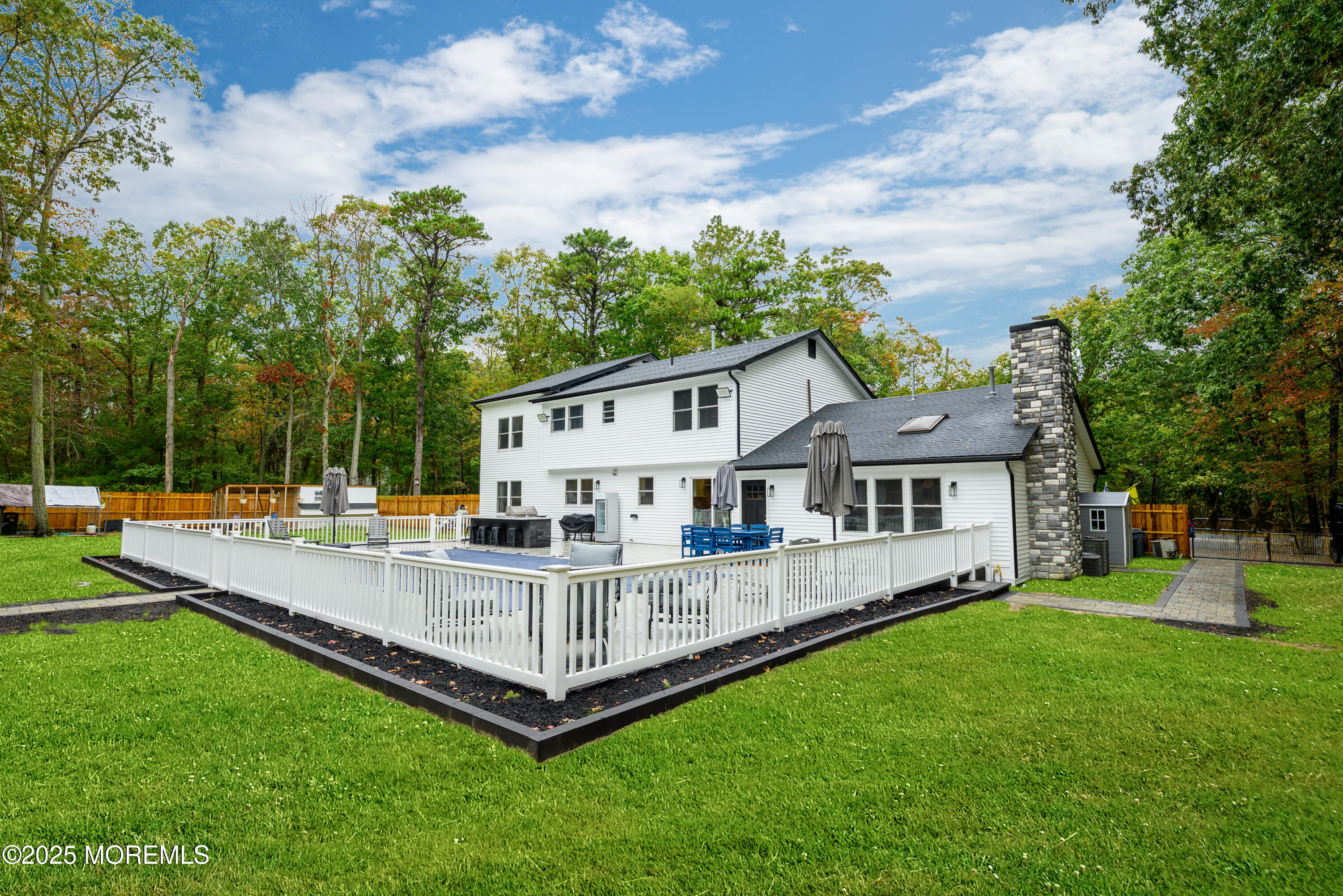 453 Stage Road Little Egg Harbor, NJ 08087 - Photo 13 of 52 a view of a house with a backyard and a patio