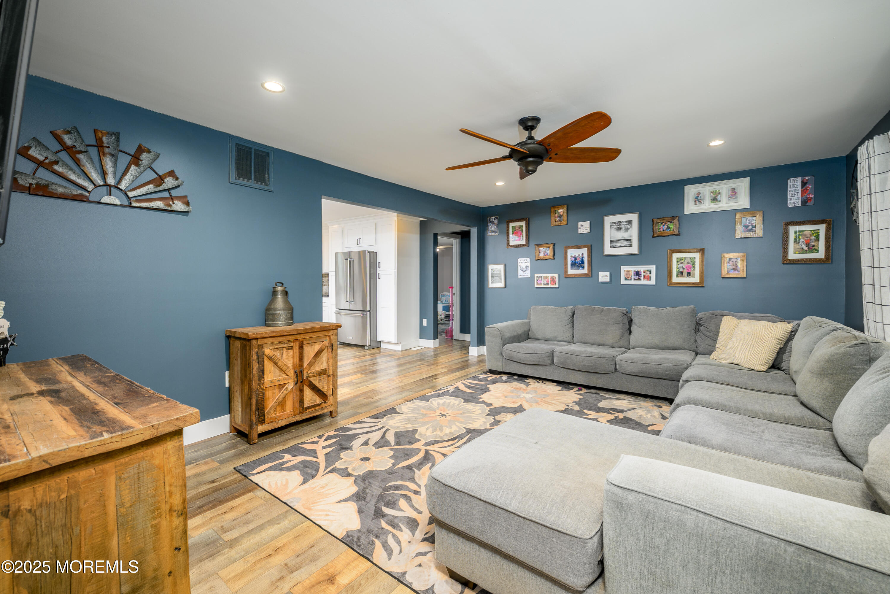 453 Stage Road Little Egg Harbor, NJ 08087 - Photo 16 of 52 a living room with furniture a ceiling fan and a rug