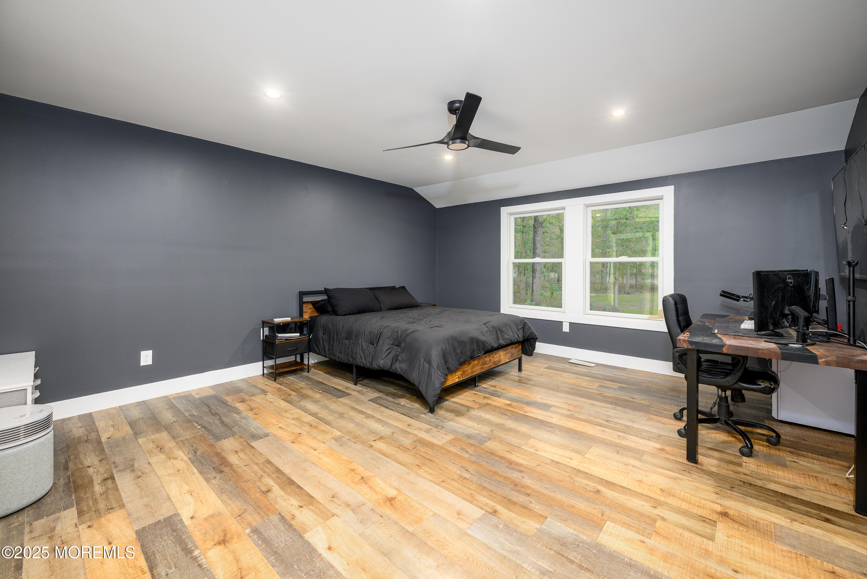 453 Stage Road Little Egg Harbor, NJ 08087 - Photo 20 of 52 a bedroom with a bed a desk and chair with wooden floor