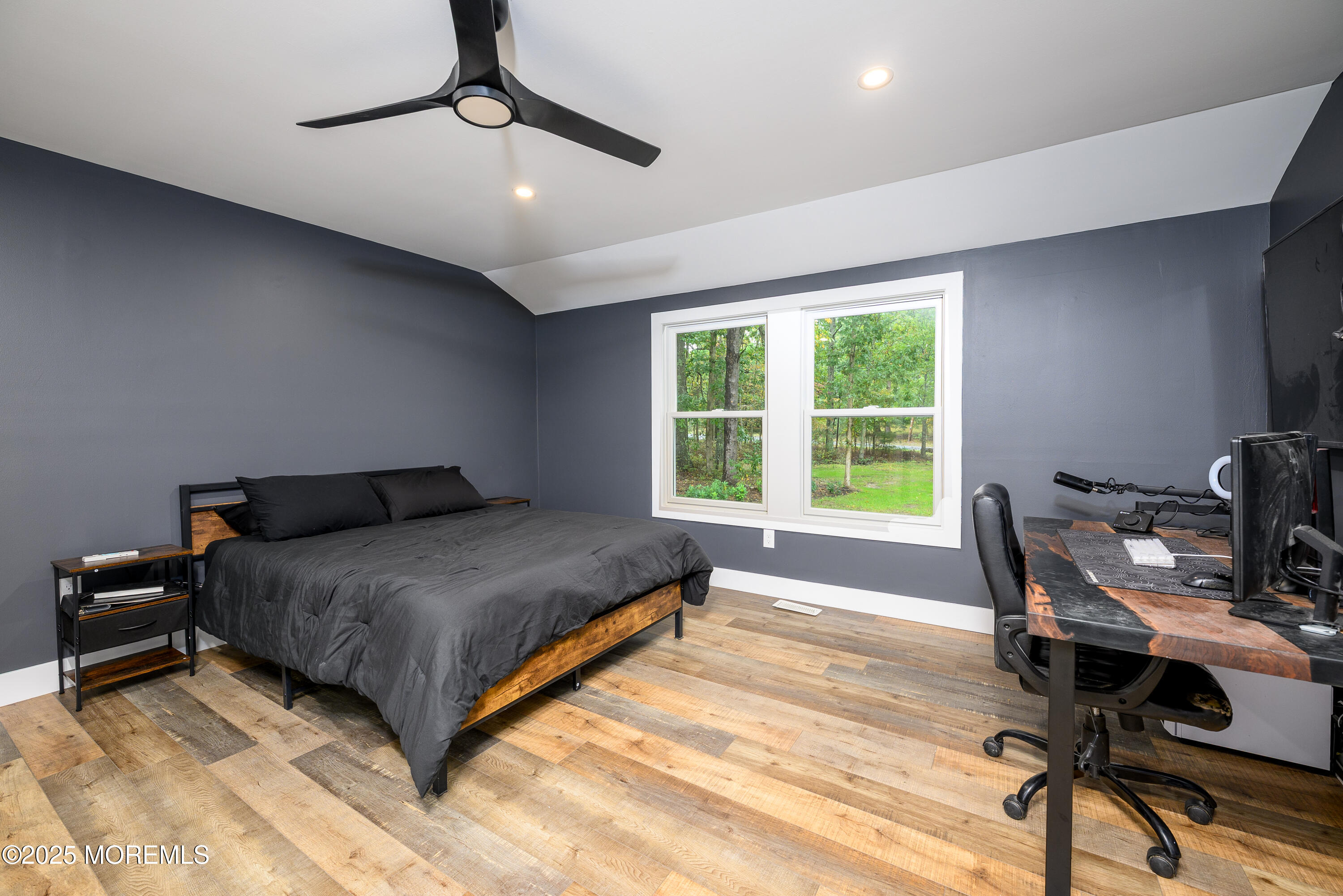 453 Stage Road Little Egg Harbor, NJ 08087 - Photo 21 of 52 a bedroom with a bed a desk and chair with the wooden floor