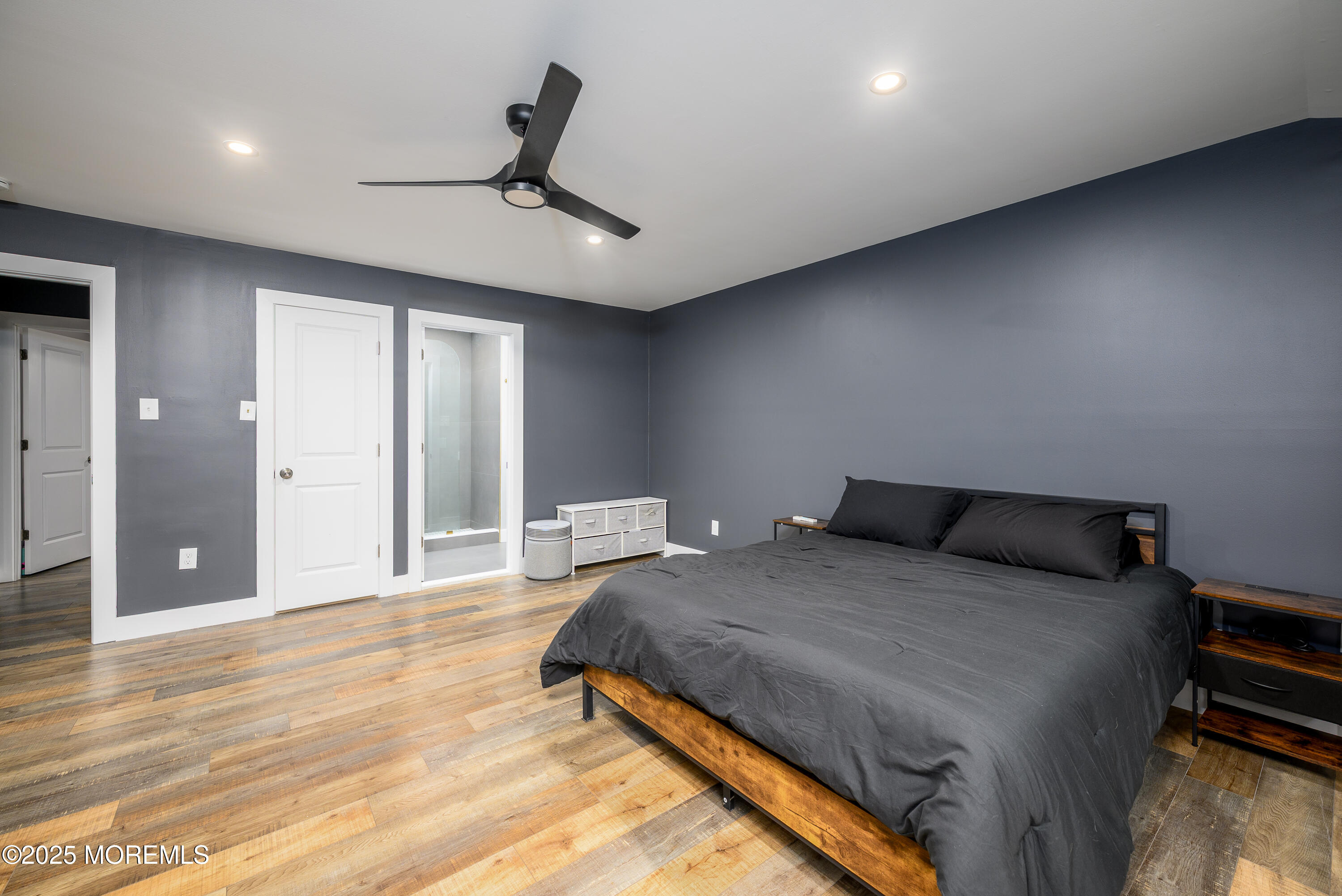 453 Stage Road Little Egg Harbor, NJ 08087 - Photo 23 of 52 a bedroom with a bed and a ceiling fan