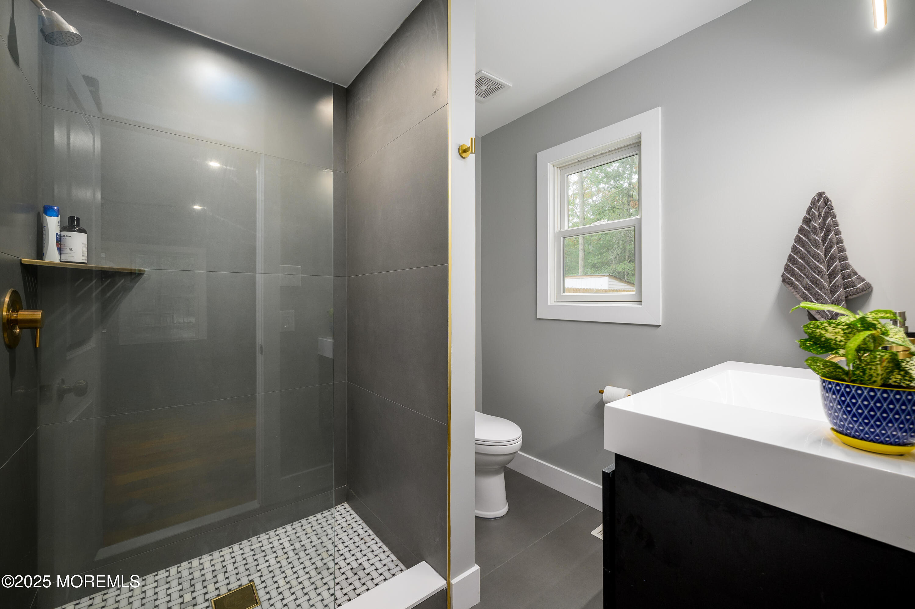 453 Stage Road Little Egg Harbor, NJ 08087 - Photo 24 of 52 a bathroom with a sink a toilet a window and shower