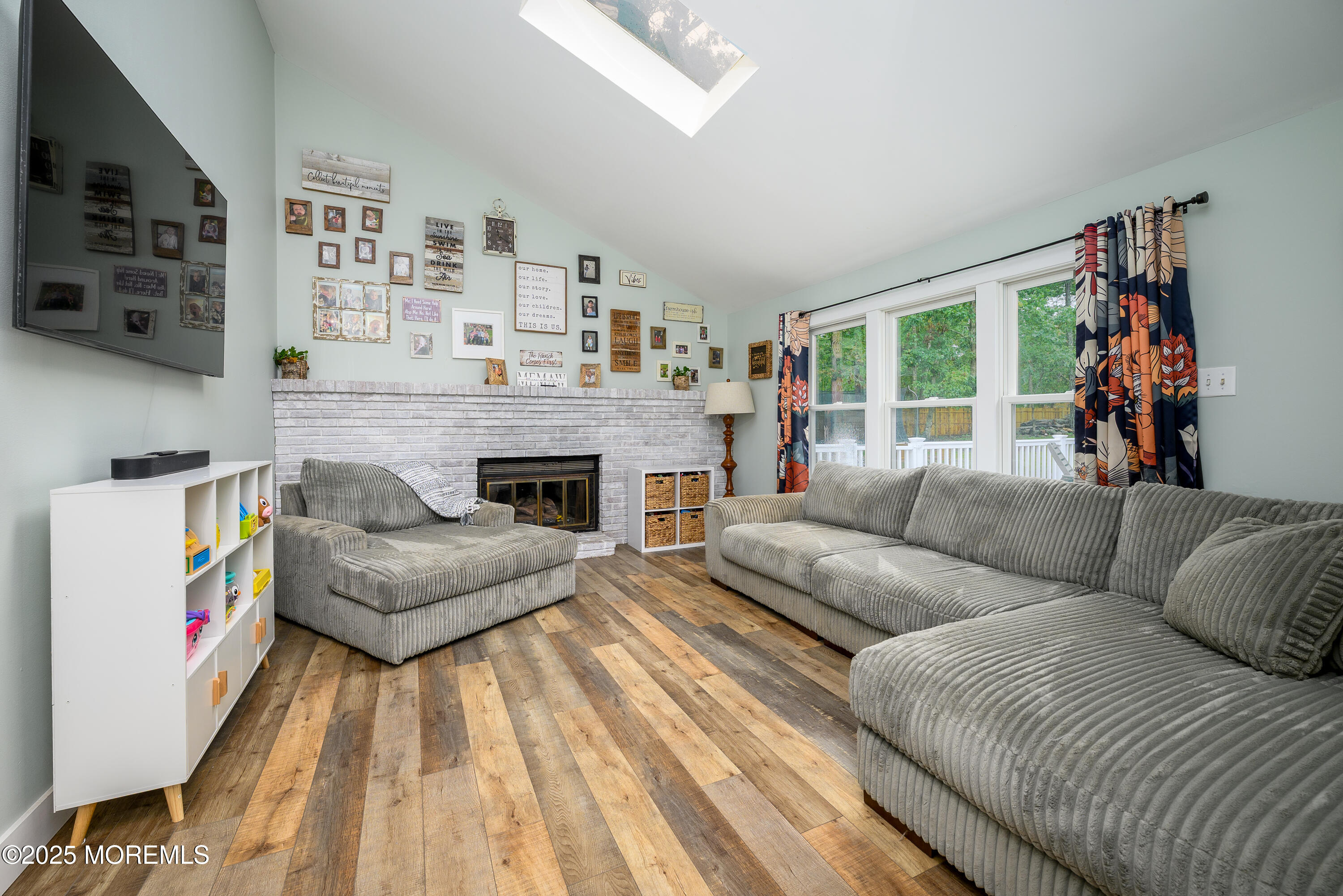 453 Stage Road Little Egg Harbor, NJ 08087 - Photo 26 of 52 a living room with furniture and a fireplace