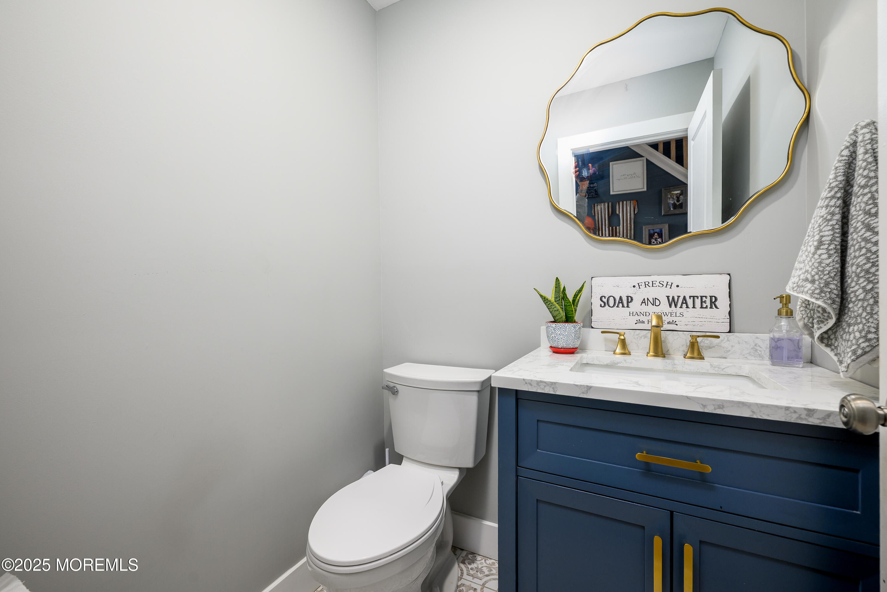 453 Stage Road Little Egg Harbor, NJ 08087 - Photo 29 of 52 a bathroom with a toilet a sink and mirror