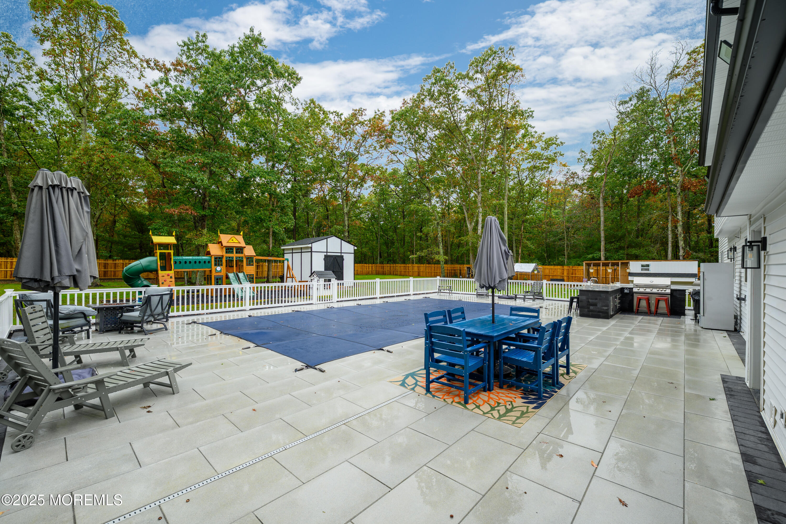 453 Stage Road Little Egg Harbor, NJ 08087 - Photo 7 of 52 a view of a patio with table and chairs potted plants and a palm tree