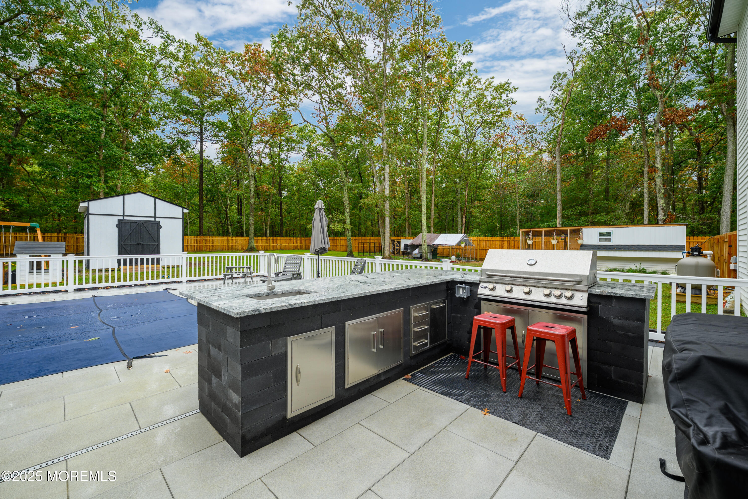 453 Stage Road Little Egg Harbor, NJ 08087 - Photo 8 of 52 an outdoor sitting area with a stove