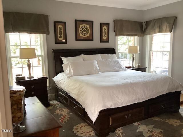 2125 Keith Hills Road Lillington, NC 27546 - Photo 29 of 66 a bedroom with a bed and wooden floor