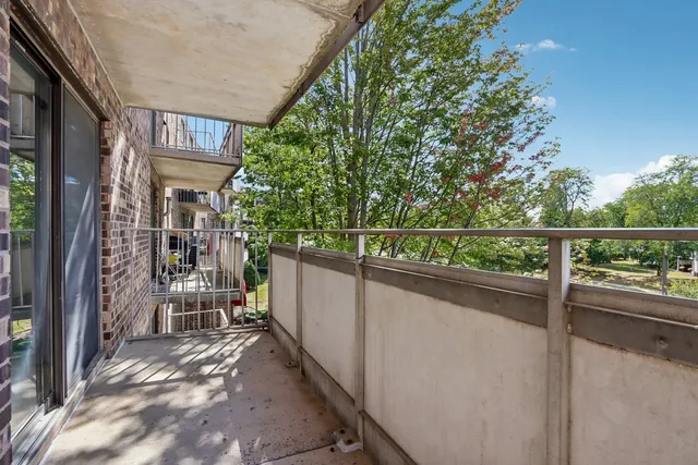 a view of a balcony with furniture
