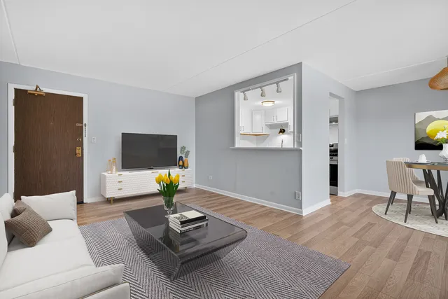a living room with furniture and a table