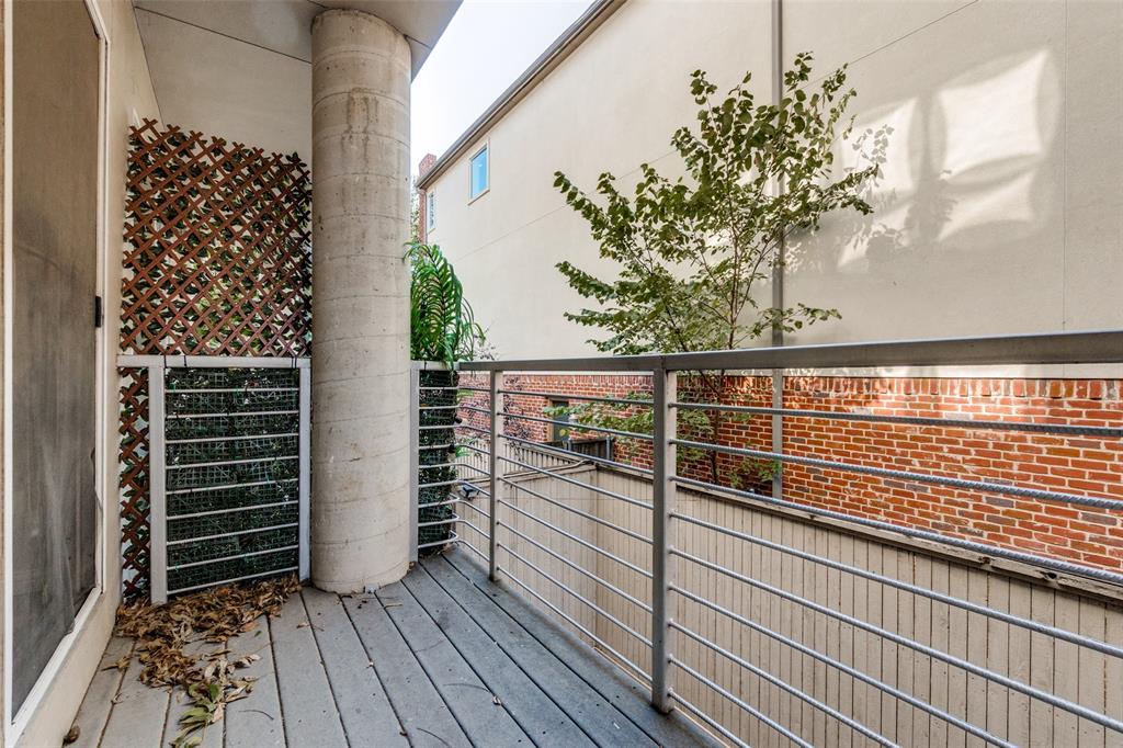 4231 Travis Street, Unit 20 Dallas, TX 75205 - Photo 13 of 23 a view of a balcony with wooden floor