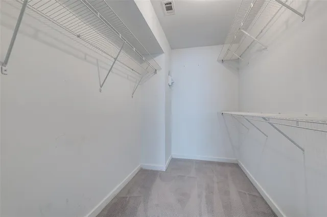 a bathroom with a granite countertop sink a mirror and a shower
