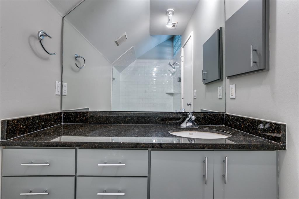 4231 Travis Street, Unit 20 Dallas, TX 75205 - Photo 22 of 23 a bathroom with a sink and a mirror