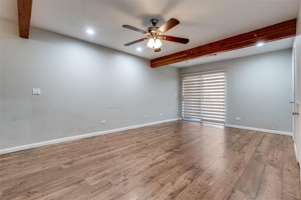 4231 Travis Street, Unit 20 Dallas, TX 75205 - Photo 3 of 23 a view of an empty room with window and wooden floor
